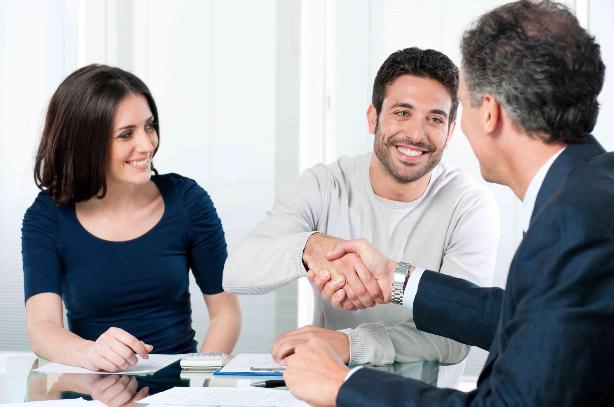 bigstock Happy couple seal a deal with 14508980 c r